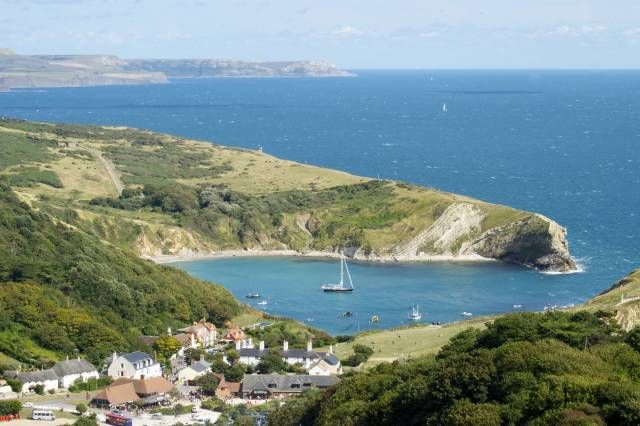 an aerial view of a small village on the coast