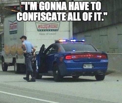 a police officer standing next to a truck