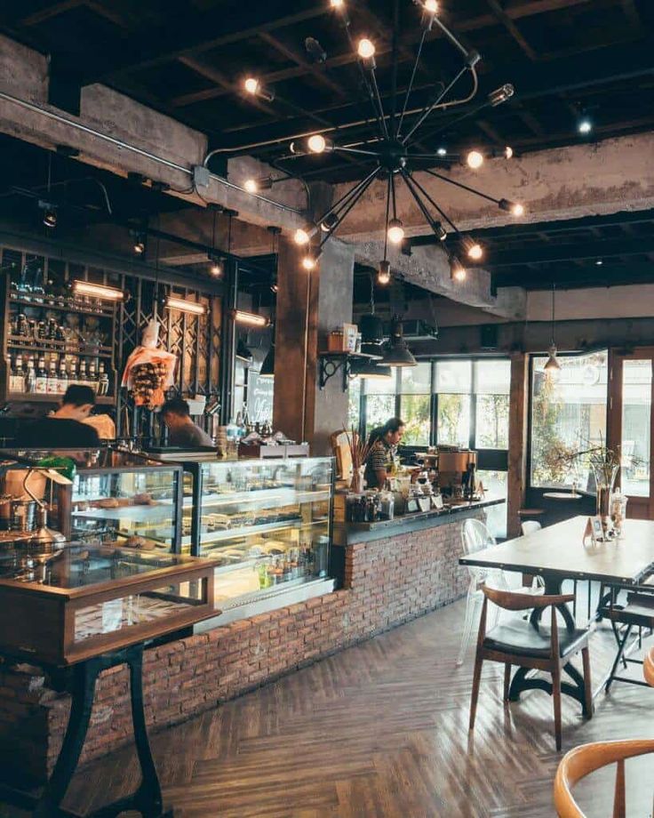 the inside of a restaurant with tables and chairs