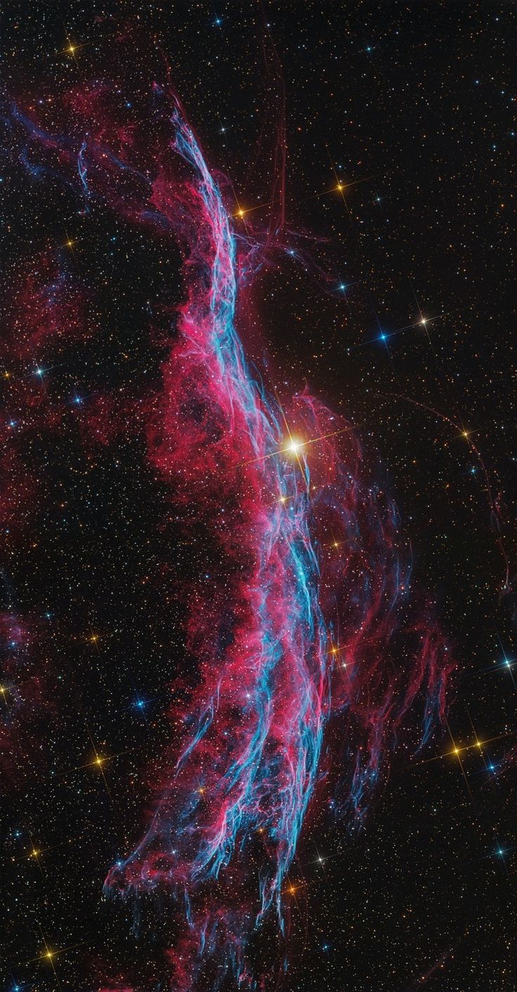 an image of some very pretty stars in the night sky with bright blue and red colors