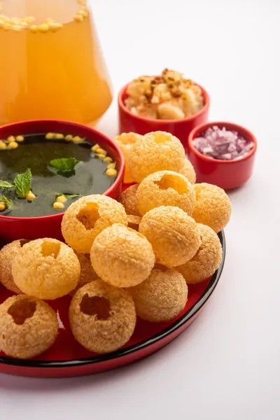 a plate full of fried food with dipping sauce