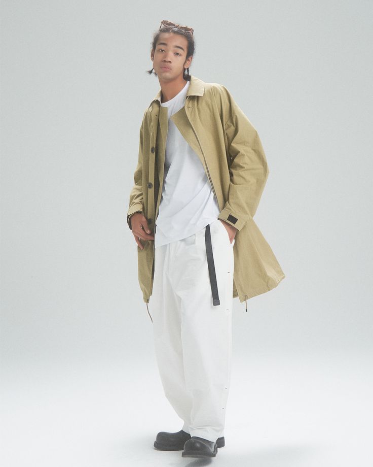 Complete the look Model info Height: 185cm, 6'1 Weight: 65kg, 143pound Size: L-XL The model is also styled with innerwear: Off The Label Super Soft logo T-shirt | Dupont™ Sorona®Materials Off The Label belt parachute cargo pants About this coat Khaki cotton blend classic collar front button fastening long sleeves long length Idea behind It's been a while since we last designed a trench coat back in 2019, but we're excited to announce our newest off the label trench coat for the upcoming season! And this time, we're injecting simplicity into the design. We wanted to create a trench coat that not only looked stylish and but also made the wearer feel playful and easy to style. The straightforward single-breasted silhouette achieves a minimalist aesthetic. Size chart Trench Coat Back, Parachute Cargo Pants, Parachute Cargo, Classic Trench Coat, Khaki Color, Minimalist Aesthetic, Logo T Shirt, Affordable Fashion, Long Length