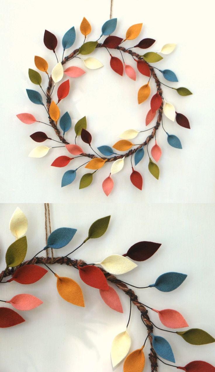 two pictures of different colored leaves hanging on the wall, one is made out of paper and