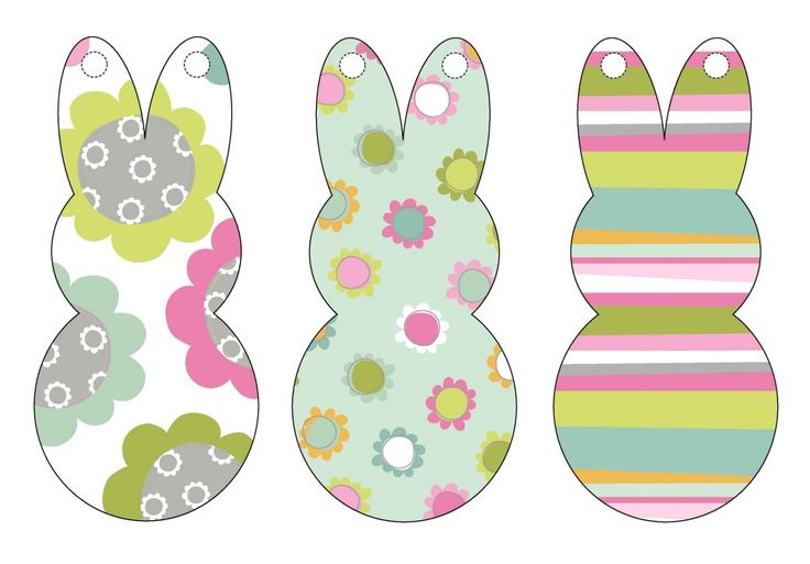 three easter bunnies with flowers and stripes on the front, one has an egg in the