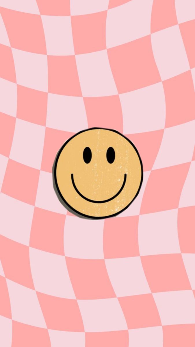 a smiley face on a pink and white checkered background