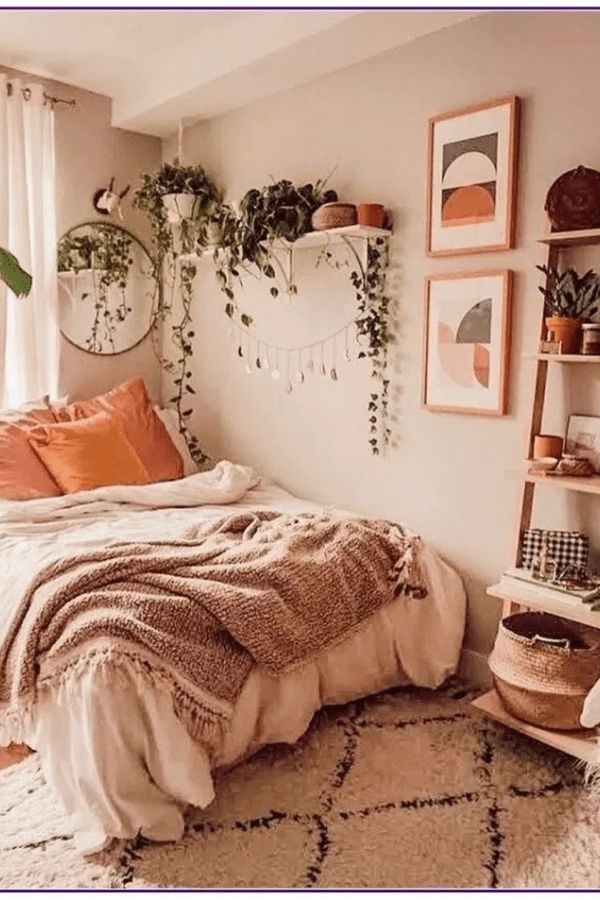 a bedroom with lots of plants and pictures on the wall above the bed, along with an area rug