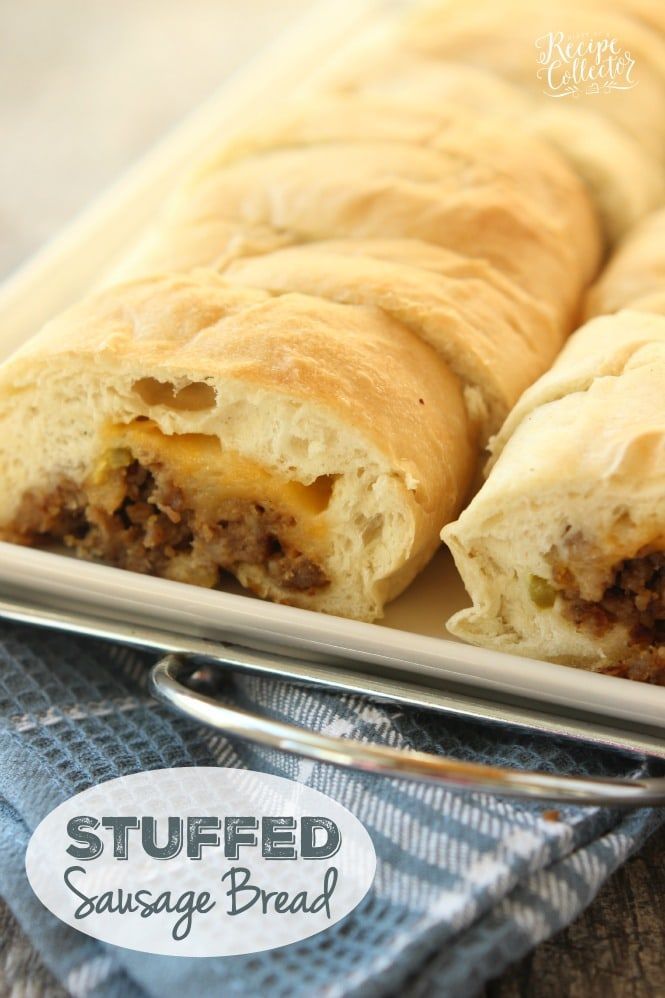 two sausage rolls on a plate with a fork