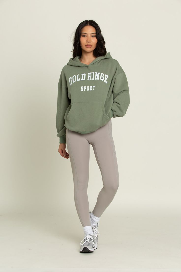 Our perfectly oversized Green GH Sport Hoodie Sweatshirt gives you the feeling of comfort and style in one staple hoodie. The dual side pockets give you an extra place to keep everyday essentials. Along with a hood to allow you to change your look to match wherever you're off to next. Sweaty Workouts, Tennis Skirts, Sports Hoodies, Athleisure Fashion, Athletic Top, Yoga Tops, Everyday Essentials, Bra Tops, Hoodie Sweatshirt