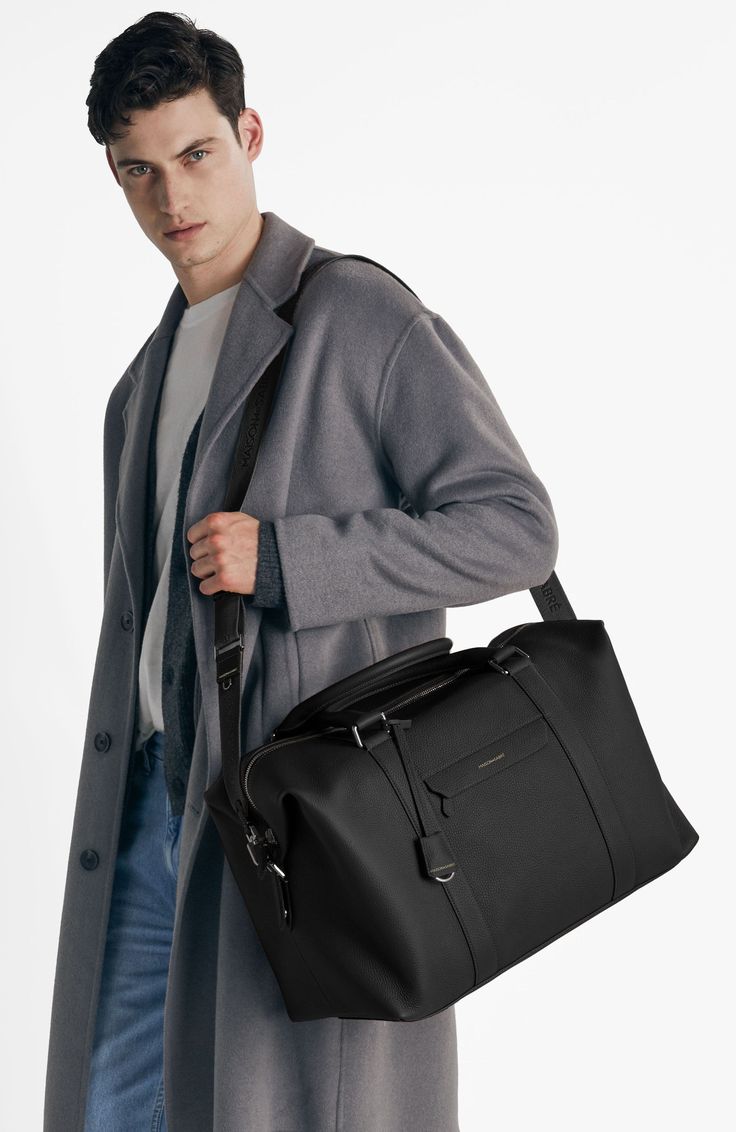 A lightweight all-leather companion overflowing with dynamic storage and multifaceted carriage for first class journeys. Inspired by thousands of miles transiting between airports, The Duffle features an expandable silhouette for enhanced visibility and effortless retrieval of your belongings, convertible trolley sleeve to carry atop luggage, dedicated phone, passport and laptop pockets, a detachable jacquard strap and slides perfectly into every overhead compartment. A thoughtful travel sidekic Sustainable Leather, Leather Duffle Bag, Leather Duffle, Black Caviar, Laptop Pocket, Online Bags, Full Grain Leather, Flap Pocket, Laptop Sleeves