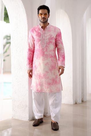 Pink tie-dye pattern mirror embroidered straight kurta. Paired with a pyjama.
Components: 2
Pattern: Embroidered
Type Of Work: Mirror
Neckline: Band collar
Sleeve Type: Long
Fabric: Pure Linen
Color: Pink
Other Details: 
Approx. product weight: 1 kg
Note: Outfit worn by the model on the right is not for sale.
Occasion: Mehendi and Puja - Aza Fashions Traditional Indian Mens Clothing, Indian Wedding Suits Men, Wardrobe Planner, Wedding Kurta For Men, Indian Groom Wear, Gents Kurta Design, Haldi Outfit, Red Kurta, Diwali Outfits