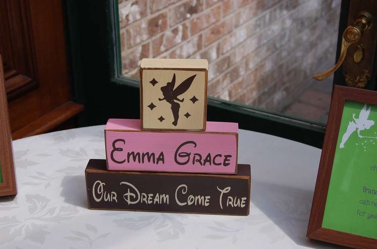 wooden blocks with the words emma grace and our dream come true on them sitting on a table