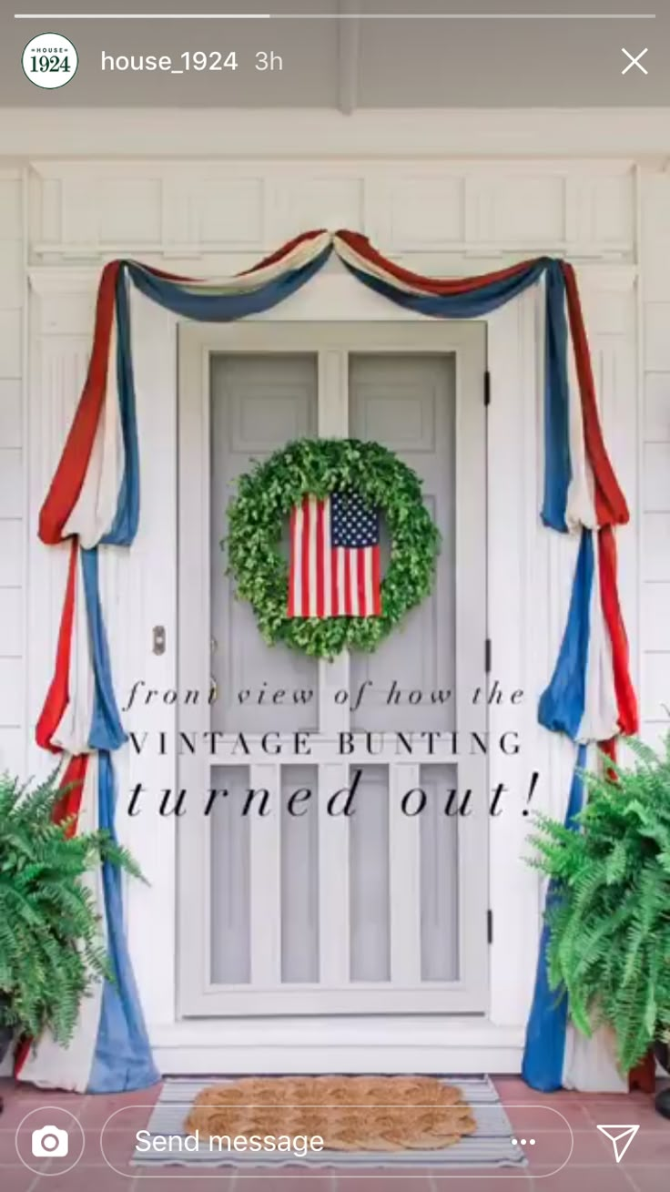 an american flag wreath on the front door of a house