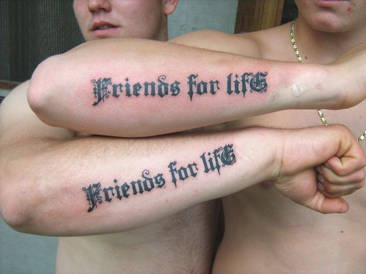 two men with tattoos that say friends for life and friends for life on their arms