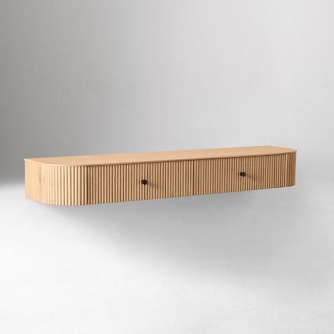 a wooden shelf sitting on top of a white wall