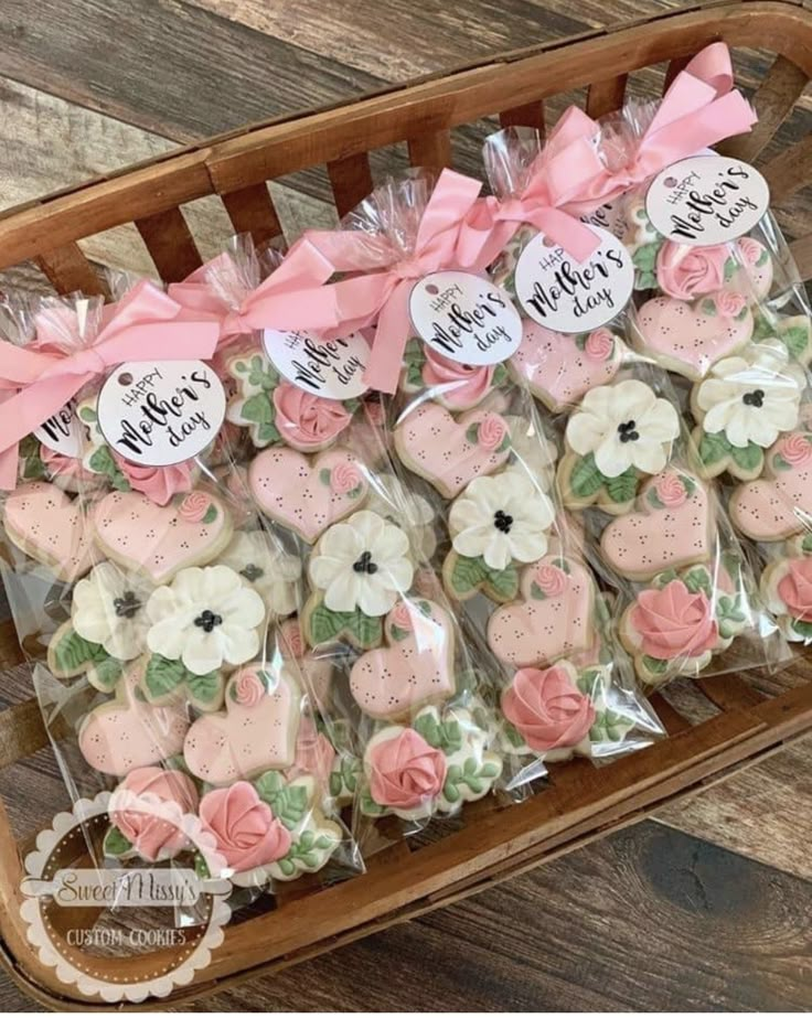 a basket filled with lots of decorated cookies