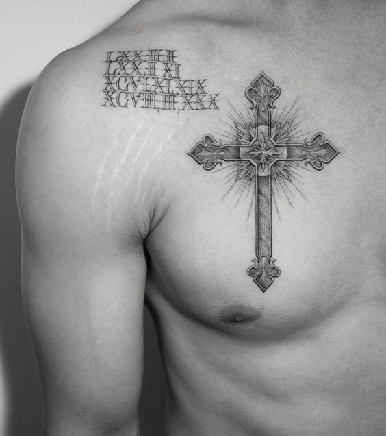 a man with a cross tattoo on his chest