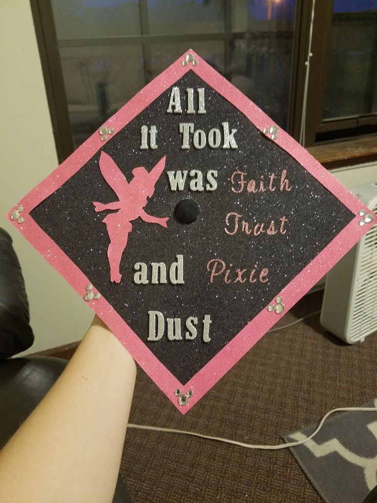 a pink and black graduation cap that says, all it took was faith trust and pixie dust