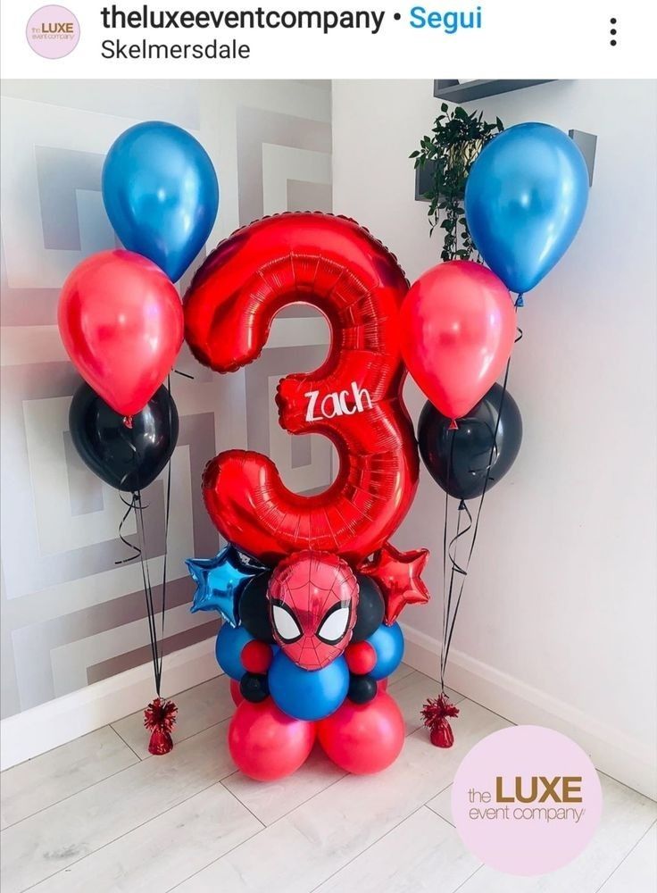 the number three balloon arrangement is decorated with spiderman balloons and red, black, and blue balloons