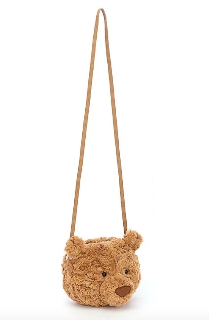 A golden bear to bear your belongings! A Jellycat most loved character, the Bartholomew Bear Bag is ruffled and ready in maple-syrup fur, with petal-fold ears and a chunky muzzle. This cross-body bag has a caramel lining, strong webbed strap and sturdy silver zipper. Strap length 117cm Brown Bear Design Bags For Everyday Use, Brown Bags With Bear Design For Everyday Use, Jellycat Bear, Bartholomew Bear, Bear Bag, Golden Bear, Silver Zipper, Maple Syrup, Body Bag