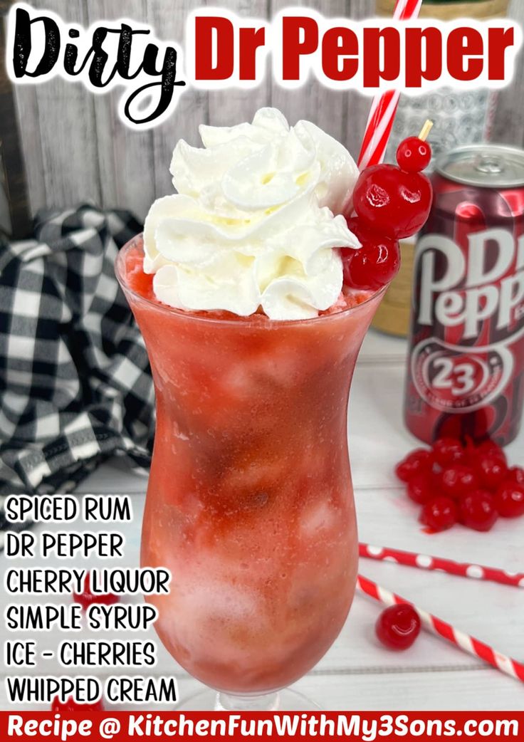 a red drink with whipped cream and cherries in it next to a can of dr pepper