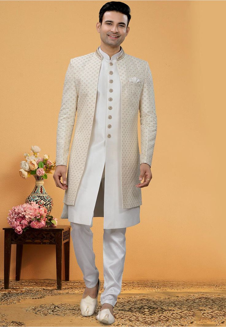 Art Silk Sherwani in Off White This Readymade attire is Enhanced with Buttons, Resham, Sequins and Beads Work. Crafted in Chinese Collar Neck and Full Sleeve Available with an Art Silk Pant in Off White and an Art Silk Long Jacket in Off White Do note: Bottom Style and Footwear shown in the image is for presentation purposes only. Half to one inch may vary in measurement. (Slight variation in actual color vs. image is possible) Engagement Dress For Groom, Wedding Kurta For Men, Sherwani For Men, Men's Ethnic Wear, Court Dresses, Chinese Collar, Beads Work, Utsav Fashion, Floral Pajamas