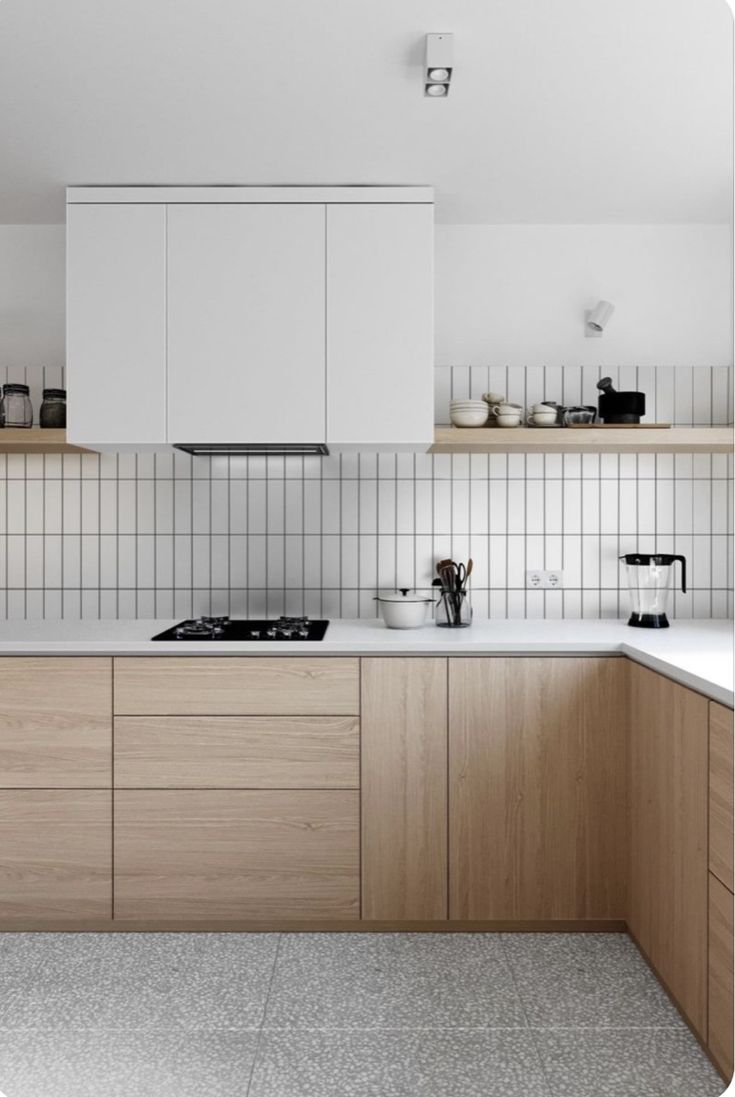 a kitchen with wooden cabinets and white counter tops