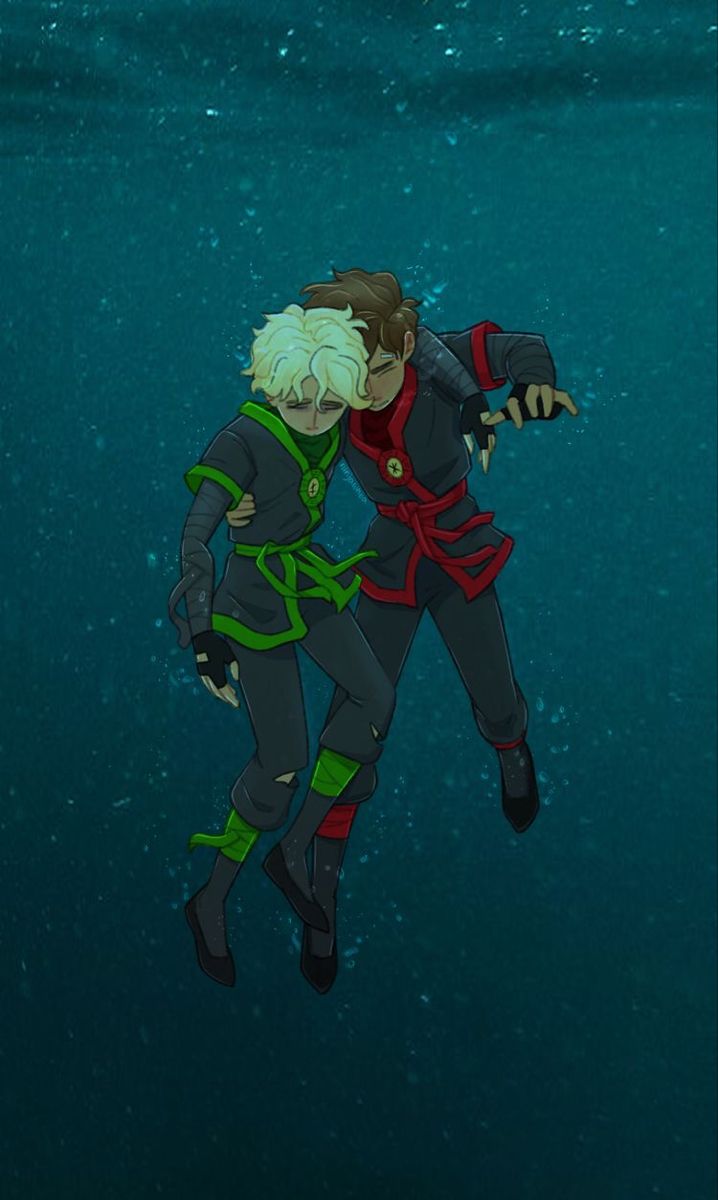 two people are floating in the water with their arms around each other and looking at something