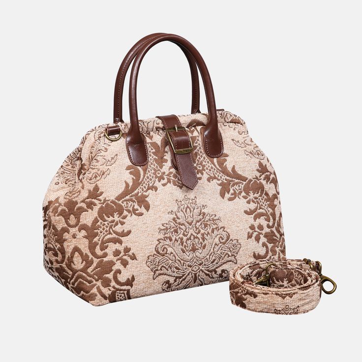 With a nod to the Victorian era, MCW’s freshly combines the classic and elegant design of the traditional carpet bag with a textural and tactile twist.The main body of purse-sized bags is made with thick chenille carpets. The handles and belts are genuine leather with heavy cotton canvas lining. Six bronze stands at the bottom allow the bag to stand stably. Every bag comes with a detachable and adjustable shoulder strap (55 inches) made from the same chenille as the bag and fixed with high-quali Brown Bag With Removable Pouch And Round Handle, Luxury Beige Satchel Weekender Bag, Elegant Brown Top Handle Weekender Bag, Brown Satchel With Round Handle For Travel, Beige Luxury Satchel With Rolled Handles, Luxury Beige Satchel With Rolled Handles, Luxury Beige Weekender Bag With Double Handle, Brown Shoulder Bag With Rolled Round Handles, Brown Travel Bag With Round Handle