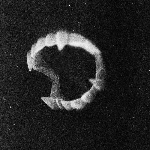 a black and white photo of a circular object