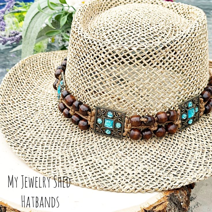 "A hatband adorned with turquoise and wood beads, creating a rustic yet vibrant accessory that combines the natural warmth of wood with the calming hues of turquoise, adding a touch of Southwestern charm to any hat Looking to add some Bohemian vibes to your hat? This beautiful, handmade Macrame hat band is fully adjustable for a custom fit for your hat. Made with 100% Cotton cord with wood beads and turquoise slider accents. Look great on your summer concert hat.   This would look great at a Country style wedding or on a cowboy hat! Also, works on a Fedora or Jazz Hat. Also, Great on a Straw Hat!!  If you are looking to add a little special touch to your hat, this gorgeous hat band is perfect for that!  It looks great on a cowboy hat or straw hat.  HAT NOT INCLUDED. Used only for photograp Macrame Hat Band, Macrame Western, Concert Hat, Straw Hat Diy, Macrame Hat, Jazz Hat, Hat Decor, Hat Diy, Boho Turquoise