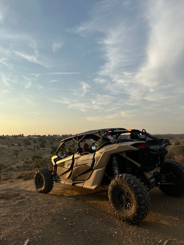 a can - am commander off roading in the desert