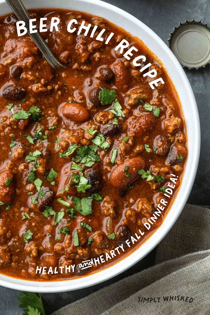 a white bowl filled with chili and meat