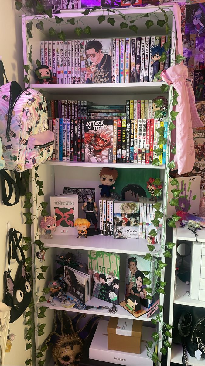 a book shelf filled with lots of books next to a wall covered in pictures and plants