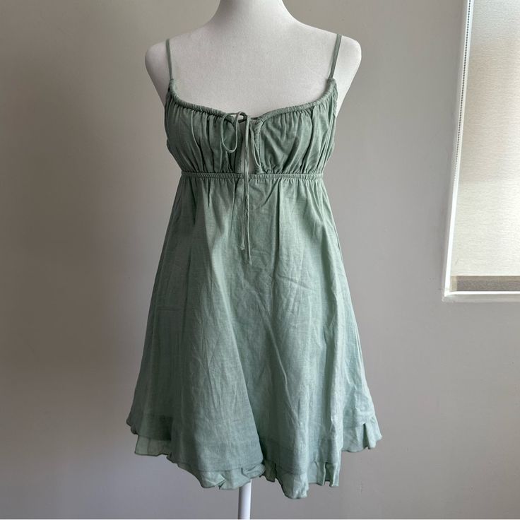 Mini Dress Relaxed Fit 70% Rayon 30% Linen Length Of Size Us 4 / Au 8 Shoulder To Hem Adjusts From: 67cm - 80cm / 26.3" - 31.4" Single Tie At Bust V Neckline Slim Adjustable Straps Button & Loop Fastening At Back Elasticated Back & Bust Partially Exposed Back Ruffle Hemline Non Stretch Fully Lined Green Flowy Cotton Mini Dress, Princess Polly Green Flower Dress, Green Rayon Mini Dress, Summer A-line Mini Dress With Button Closure, Green Button-up Mini Dress With Button Closure, Neckline Slimmer, Dress Sage, Polly Dress, Striped Mini Dress