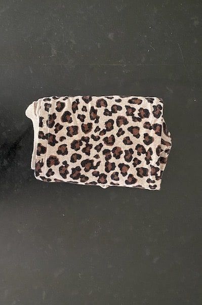 an animal print purse sitting on top of a table