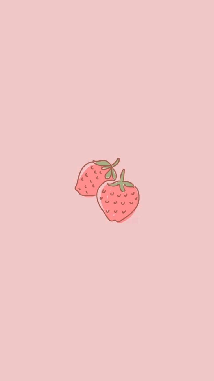 two strawberries on a pink background