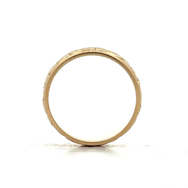 Enjoy the elegance of the past with this vintage Mid-Century unisex wedding band. Crafted in 14 karat yellow gold, this ring showcases a beautiful orange blossom engraving that adds a unique, artistic flair. At 6.5 mm wide, the band provides a comfortable fit while texture is enhanced by a high polish finish. The ridged edge detailing enhances its visual appeal with intricate texture. Whether paired with an engagement ring or worn alone, this beautiful ring is versatile and unique. Timeless Engraved Ring With Decorative Band, Heirloom Engraved Ring Stamped 14k, Heirloom Etched Signet Ring For Wedding, Vintage Etched Promise Ring, Timeless Yellow Gold Engraved Ring With Decorative Band, Heirloom Yellow Gold Stackable Rings, Etched Yellow Gold Signet Ring For Wedding, Heirloom 14k Gold Etched Ring, Etched Yellow Gold Signet Ring For Anniversary