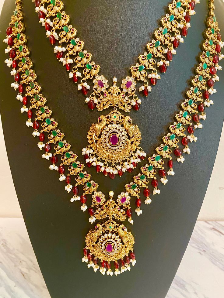 Elevate your Indian outfit with our Peacock Guttapusalu Necklace. Showcasing intricate design and detail, this necklace adds a touch of elegance and tradition to any ensemble. Handcrafted by skilled artisans, this necklace is a must-have for any collection. Jewellery Care- Keep the jewelry dry, avoid heat and contact with perfumes & water. Temple Jewelry Kundan Necklace With Peacock Design For Celebrations, Hand Set Temple Necklace For Puja, Peacock Design Chandbali Temple Necklace For Celebration, Festive Chandbali Kundan Necklace With Peacock Design, Chandbali Peacock Design Temple Necklace For Celebrations, Hand Set Chandbali Temple Necklace For Puja, Festive Temple Necklace With Peacock Design For Diwali, Festive Jewelry Sets With Peacock Design For Diwali, Bridal Necklace With Peacock Design For Festivals