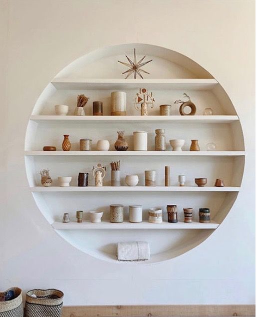 a white shelf filled with lots of different items