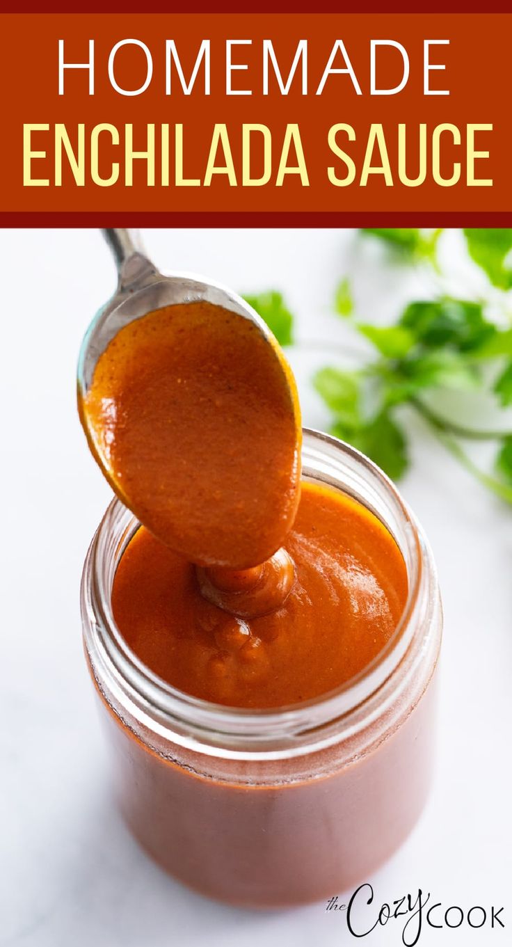 homemade enchilada sauce in a jar with a spoon