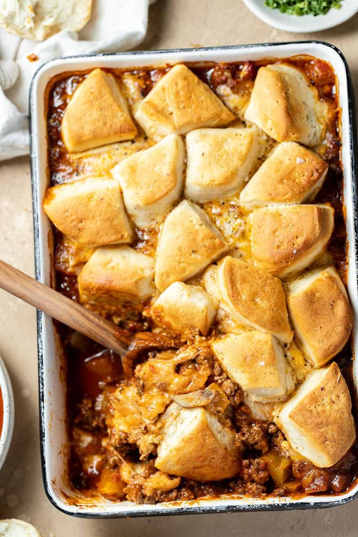 a casserole dish filled with meat and cheese