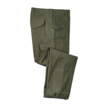 Our sturdy Field Cargo Pants combine the double-layer reinforcing of Filson's legendary Double Tin Cloth Pants with the utilitarian fit and fabric of pants issued to WWII-era troops. We patterned these field pants directly after those issued by the U.S. Army in 1941, in a reverse sateen weave true to the original. They’re cut roomy through the seat and thighs to ensure unrestricted ease of motion, featuring darts at the waist and knees for a better fit. Front and rear pockets are protected by fl Olive Military Cargo Pants With Multiple Pockets, Green Cotton Work Pants With Multiple Pockets, Olive Military Pants With Cargo Pockets, Green Combat Cotton Cargo Pants, Green Cotton Combat Cargo Pants, Green Full-length Cargo Jeans With Patch Pockets, Olive Military Cargo Pants With Patch Pockets, Utility Olive Cargo Pants For Outdoor, Olive Utility Cargo Pants For Outdoor