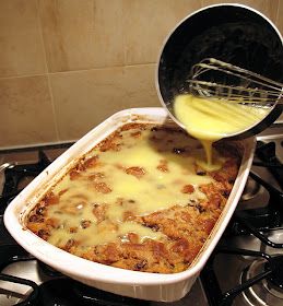 a pan filled with food sitting on top of a stove