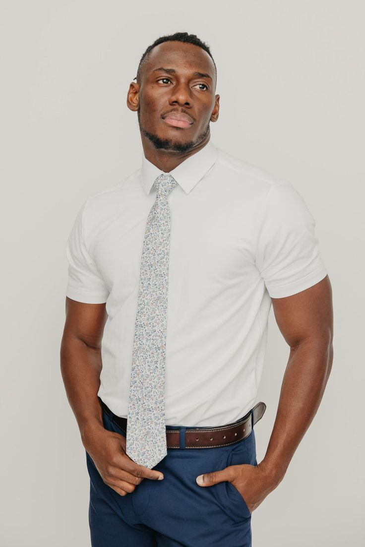 We pride ourselves in offering our customers some of the best skinny ties money can buy. Each DAZI tie is handmade from high quality imported fabrics. Features: Approx. 2.5" wide at the tip Approx. 58" in length 100% Cotton Dapper Fitted Tie, Dapper Standard Tie, Dapper Fitted Standard Tie, Fitted Cotton Tie, White Tie For Work, White Standard Tie For Work, Dapper Fitted Neckwear For Semi-formal Occasions, White Neckwear With Ties For Work, Classic Fitted Cotton Neckwear