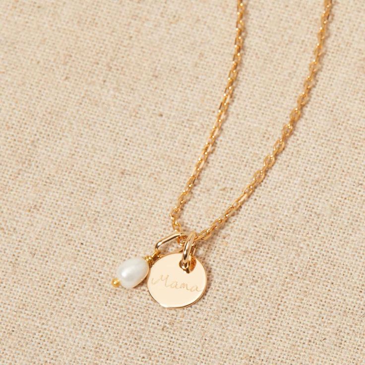 Our Personalized Mini Pearl Necklace is a timelessly elegant piece of personalized jewelry commemorate births, weddings, and special milestone moments. Celebrate new journeys ahead by personalizing this necklace with delicately hand-engraved names and dates to pair alongside a delicate pearl charm to cherish.18K Champagne Gold Plated or 925 Sterling SilverCharms measure: 0.4x0.4 (mini flat disc), 0.6x0.4 (mini pearl)Charms are removable from this chain and can be worn on all Merci Maman chain lengthsEngraved by hand in our Paris workshopSent with love in a complimentary gift boxPlease note that necklaces that have several charms may develop a certain patina, giving it a unique styleAny slight variations in lettering depth, spacing and alignment from the examples shown are part of the aesth Elegant Pendant Name Necklace With Engraving Option, Minimalist Pearl Charm Necklace For Anniversary, Elegant Necklaces With Engraving Option For Mother's Day, Elegant Charm Necklaces With Birthstone For Keepsake, Elegant Birthstone Charm Necklaces For Keepsake, Personalized Pearl Jewelry For Anniversary, Classic Engraved Charm Necklaces For Wedding, Elegant Keepsake Necklace With Engraving Option, Personalized Dainty Pearl Necklace For Anniversary