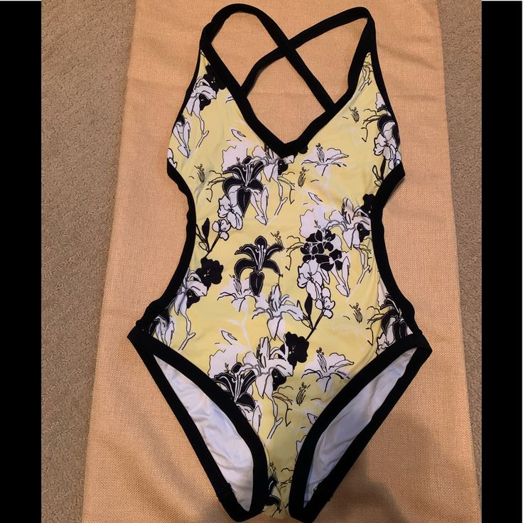 Calvin Klein Adorable 1pc. Criss Cross Open Back Swimsuit W/Bikini Style Bottom, This Has Been Washed But Never Worn. It Is A Size 10 But Runs Super Small, It Fits Like A Size 8. My Intention Was To Keep It And Lose A Little Weight And That Never Happened! The Colors Are Black, White, And Lemon Yellow, Excellent Condition. Yellow Stretch One-piece Beachwear, Yellow Lined One-piece For Beach Season, Yellow Lined Swimwear For Vacation, Summer Yellow One-piece With Lined Body, Yellow Summer One-piece With Lined Body, Summer-style Yellow One-piece With Lined Body, Yellow Lined Summer One Piece, Yellow Lined Swimwear For The Beach, Yellow Lined Swimwear For Beach