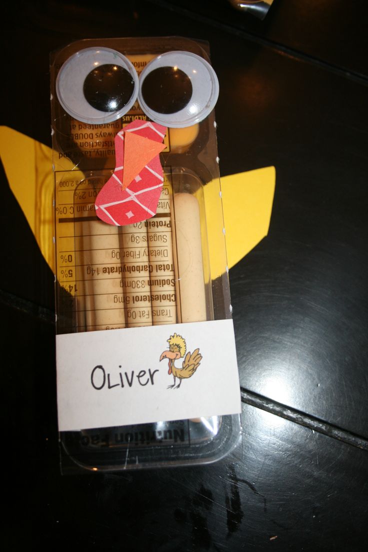 an owl made out of construction paper sitting in a package