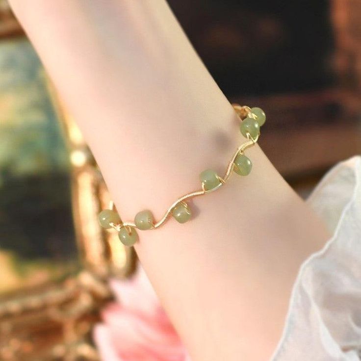 Product Details: Material: Alloy Applicable gender: female Pattern: plant flower Color classification: Gold Process: Weaving Size information: Size: one size Size: 5-6mm Package Contents: Bracelet X1 Elegant Adjustable Crystal Bracelet For Spring, Adjustable Crystal Bracelet As Spring Gift, Adjustable Crystal Bracelet For Spring Gifting, Adjustable Crystal Bracelet For Spring Gift, Spring Crystal Bracelet Gift, Adjustable, Delicate Green Jewelry For Spring, Green Resizable Beaded Bracelets, Adjustable Green Crystal Metal Bracelet, Casual Gold Flower Shaped Jewelry