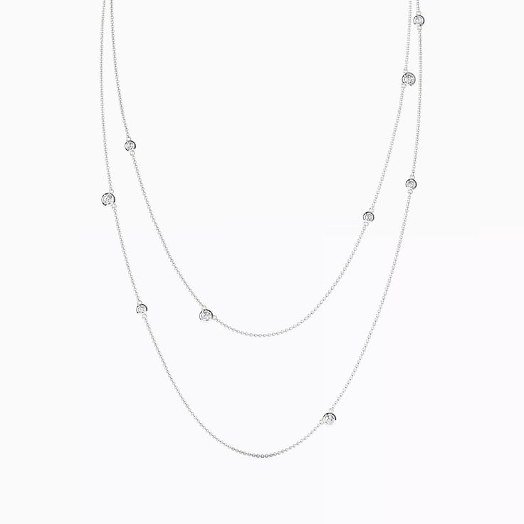 A delicate gold chain binds these celestial objects of timeless diamond. Timeless Diamond Necklace With Delicate Chain For Anniversary, Timeless Silver Solitaire Necklace With Delicate Chain, Fine Jewelry White Gold Clavicle Chain Necklace, White Gold Clavicle Chain Necklace, White Gold Long Necklace In Fine Jewelry Style, Luxury White Gold Jewelry With Delicate Chain, Timeless Cubic Zirconia Jewelry With Adjustable Chain, Luxury Diamond Station Necklace With Delicate Chain, Timeless Diamond Clavicle Chain Jewelry