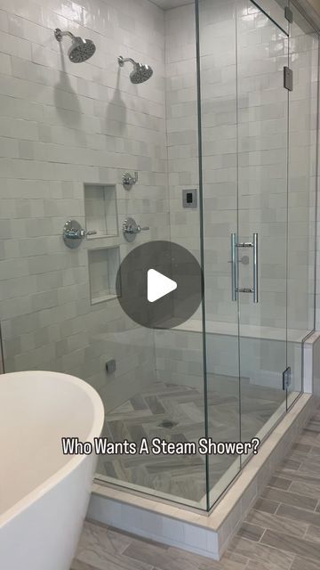 a walk in shower sitting next to a bath tub